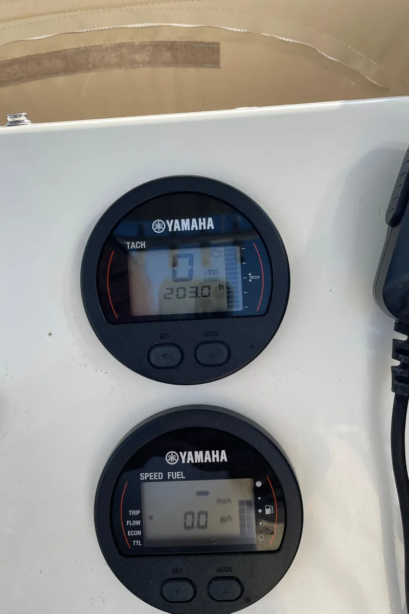 Slide: The Image of Yamaha tachometer and speed fuel gauges on a 2018 Key West 219 FS boat. - 3
