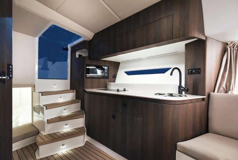 Slide: The Image of 2024 Oryx 379 yacht interior with modern kitchen and wooden stairs. - 32
