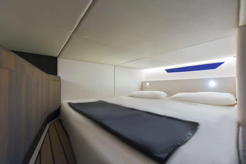 Slide: The Image of Luxurious cabin interior of 2024 Oryx 379 yacht with modern bedding and ambient lighting. - 33