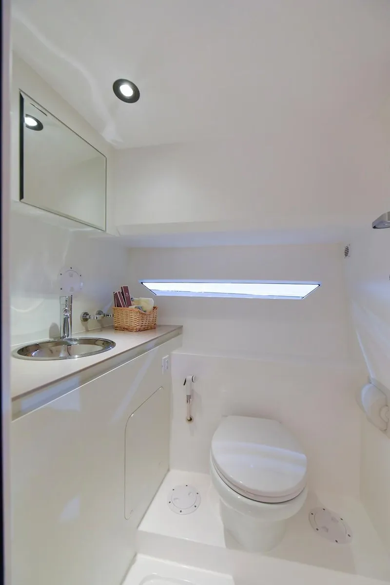 Slide: The Image of Modern bathroom in 2024 Oryx 379 boat with sleek white design. - 34
