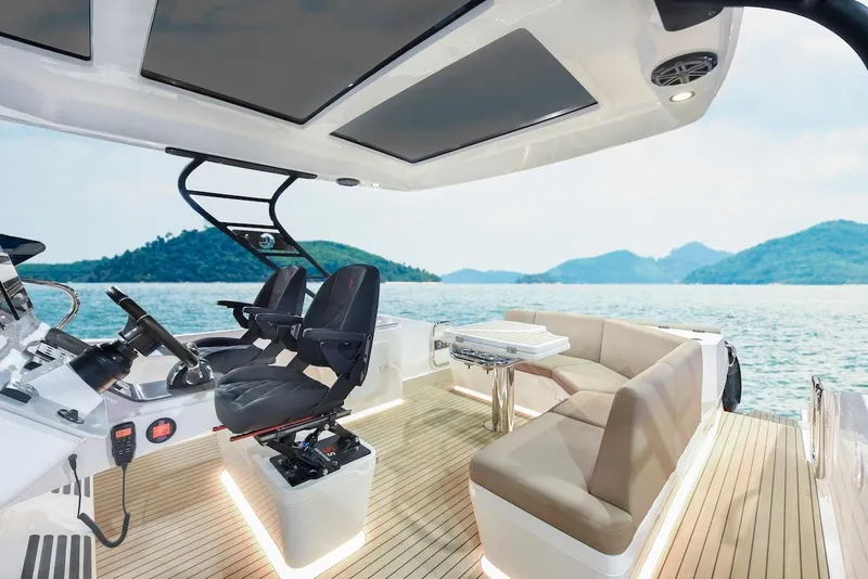 Slide: The Image of 2024 Oryx 379 boat interior with luxurious seating and scenic ocean view. - 6