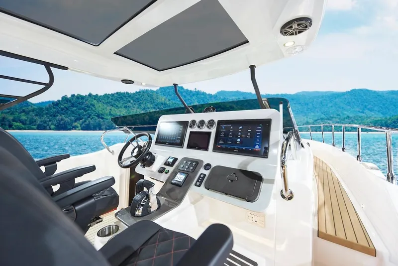 Slide: The Image of 2024 Oryx 379 yacht cockpit with advanced navigation system and luxurious seating. - 7