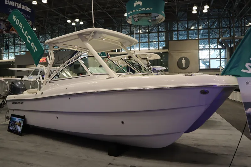The Image of 2024 World Cat 230DC boat displayed at an indoor exhibition. - 0