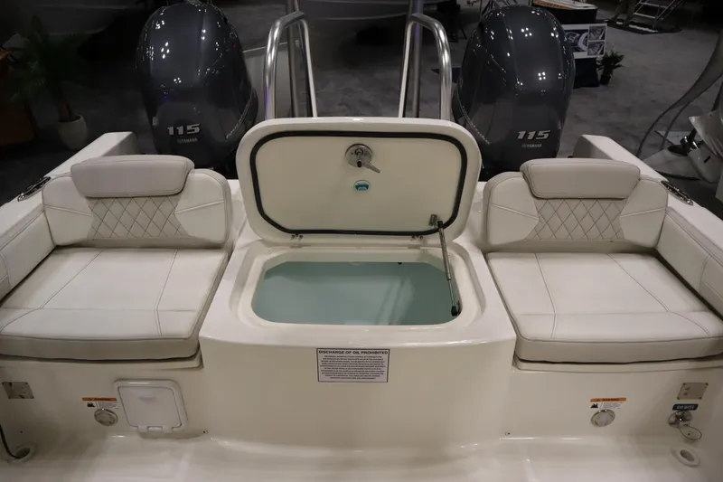 Slide: The Image of 2024 World Cat 230DC boat interior with seating and livewell. - 15