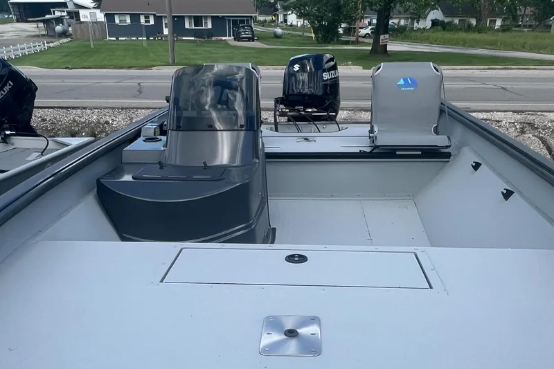 Slide: The Image of 2024 SeaArk 872 RX boat interior with Suzuki outboard motor. - 1