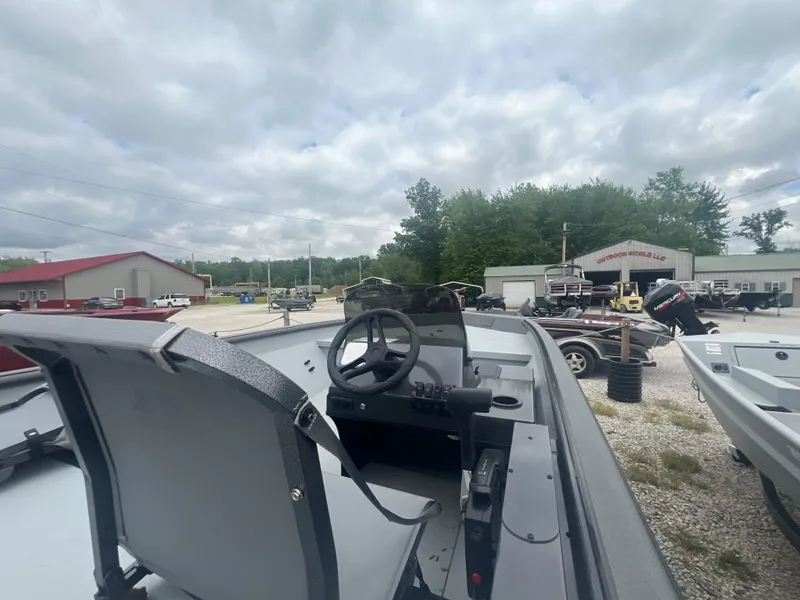 Slide: The Image of 2024 SeaArk 872 RX boat interior with steering wheel and seats. - 5