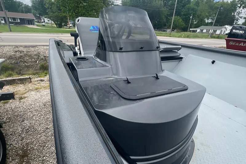 Slide: The Image of 2024 SeaArk 872 RX boat with center console and windshield. - 6