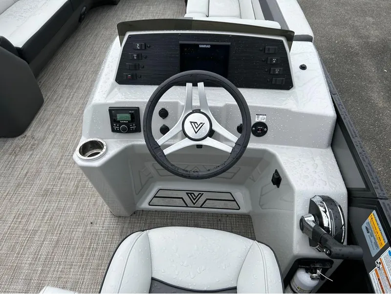 Slide: The Image of 2023 Viaggio Lago L25C boat dashboard with steering wheel and control panel. - 11