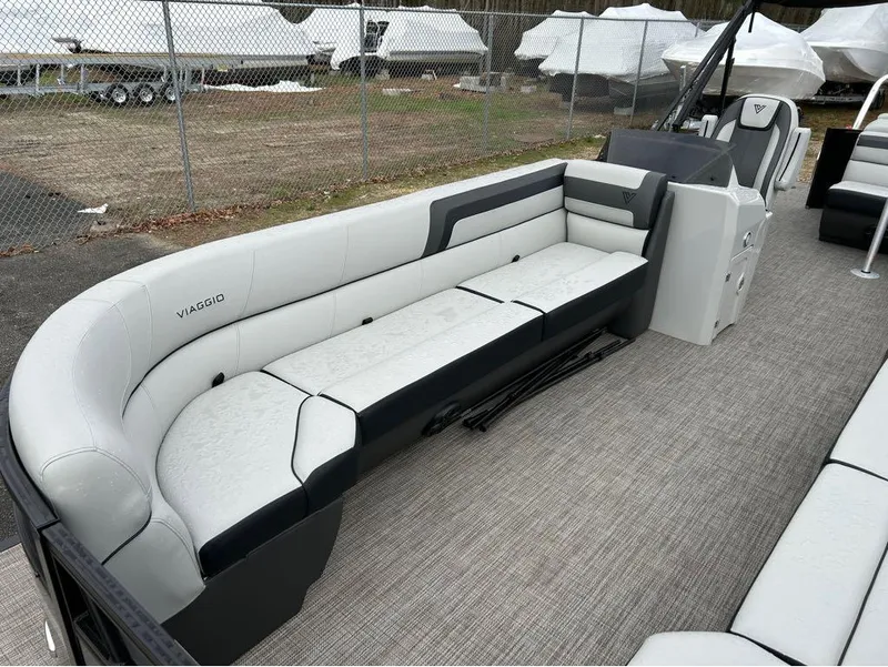Slide: The Image of 2023 Viaggio Lago L25C pontoon boat with spacious seating and modern design. - 2