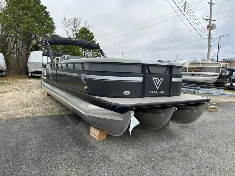Slide: The Image of 2023 Viaggio Lago L25C pontoon boat on display in a lot. - 7
