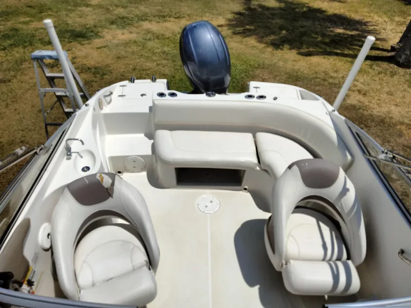 Slide: The Image of 2016 SouthWind 212 SD boat interior with seating and motor. - 20