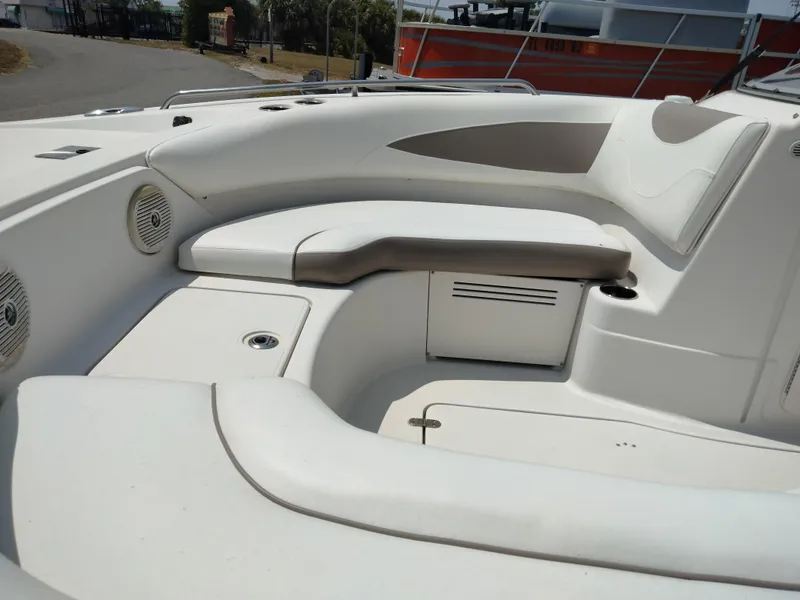 Slide: The Image of 2016 SouthWind 212 SD boat interior with white seating and storage compartments. - 22