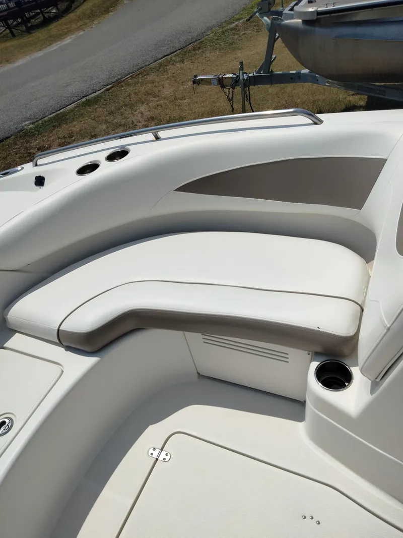 Slide: The Image of 2016 SouthWind 212 SD boat with white cushioned seating area. - 26