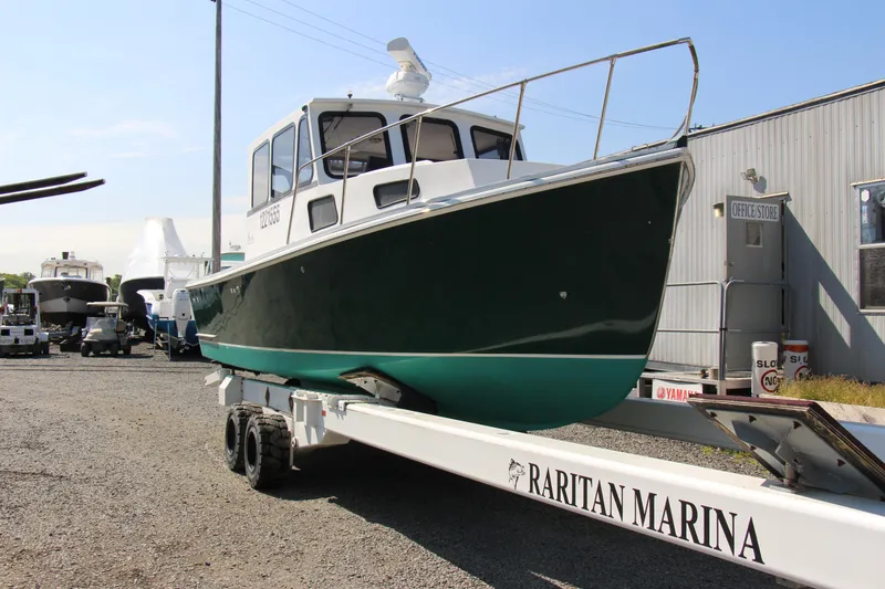 Slide: The Image of 2009 Custom Alley Boats 28 Downeast on trailer at Raritan Marina. - 10