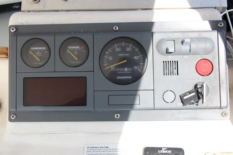 Slide: The Image of Control panel of a 2009 Custom Alley Boats 28 Downeast. - 16
