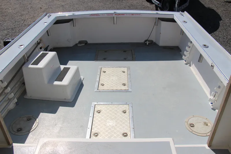 Slide: The Image of 2009 Custom Alley Boats 28 Downeast deck with storage compartments and seating. - 19
