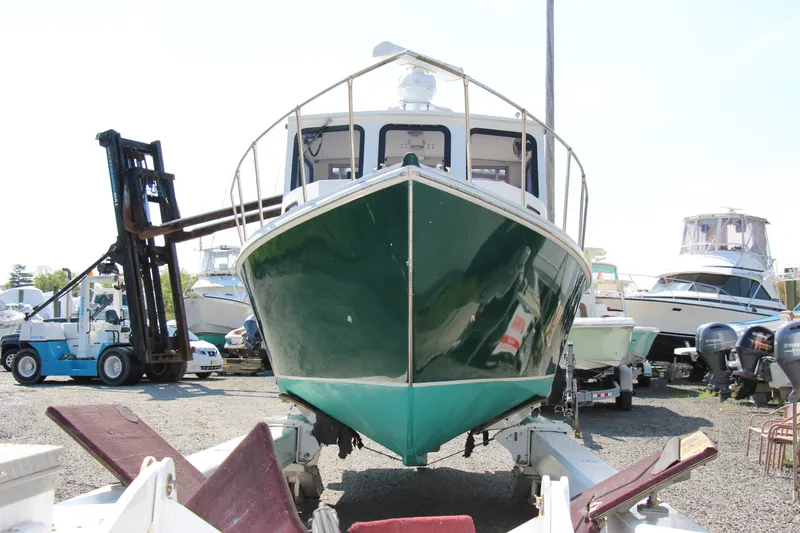 Slide: The Image of 2009 Custom Alley Boats 28 Downeast on trailer in boatyard. - 8