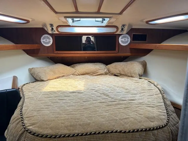 Slide: The Image of 1996 Luhrs 38 Open cabin interior with bed and skylight. - 17