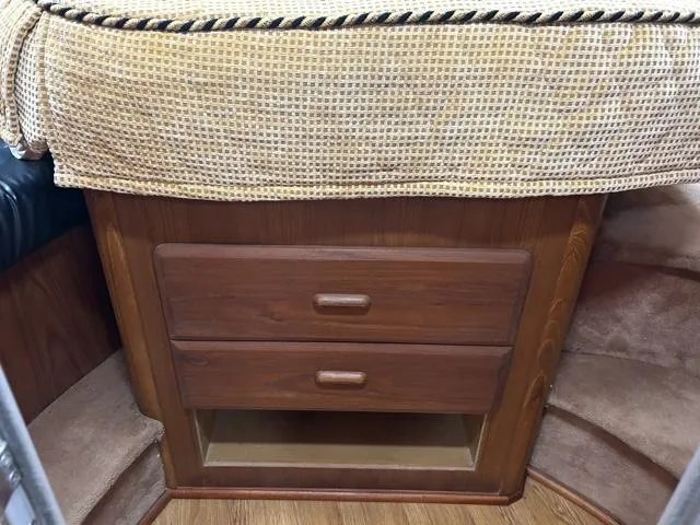 Slide: The Image of Wooden storage drawers in the cabin of a 1996 Luhrs 38 Open boat. - 18