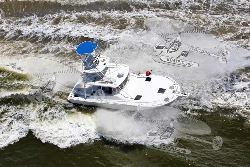 Slide: The Image of 1996 Luhrs 38 Open boat cruising through waves, aerial view. - 25