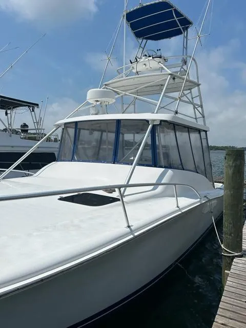 Slide: The Image of 1996 Luhrs 38 Open boat docked at marina. - 4