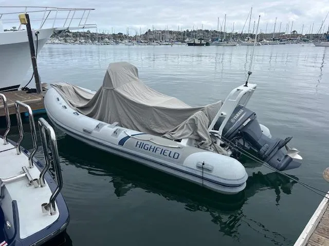 Slide: The Image of Highfield OM 500 inflatable boat docked, covered, with Yamaha outboard motor, 2017 model. - 13