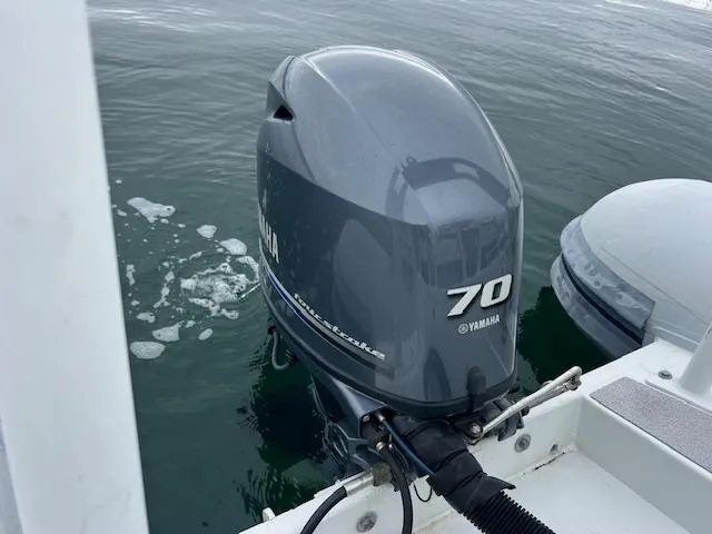 Slide: The Image of 2017 Highfield OM 500 with Yamaha 70 outboard motor on water. - 2