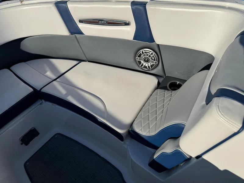 Slide: The Image of 2020 Chaparral 257 SSX boat interior seating with speaker and cup holder. - 10