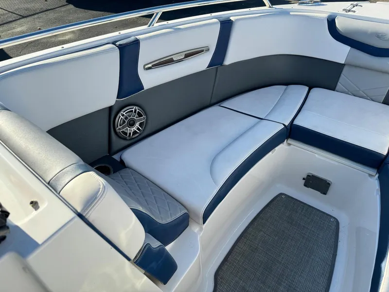 Slide: The Image of 2020 Chaparral 257 SSX boat interior with white and blue seating. - 11