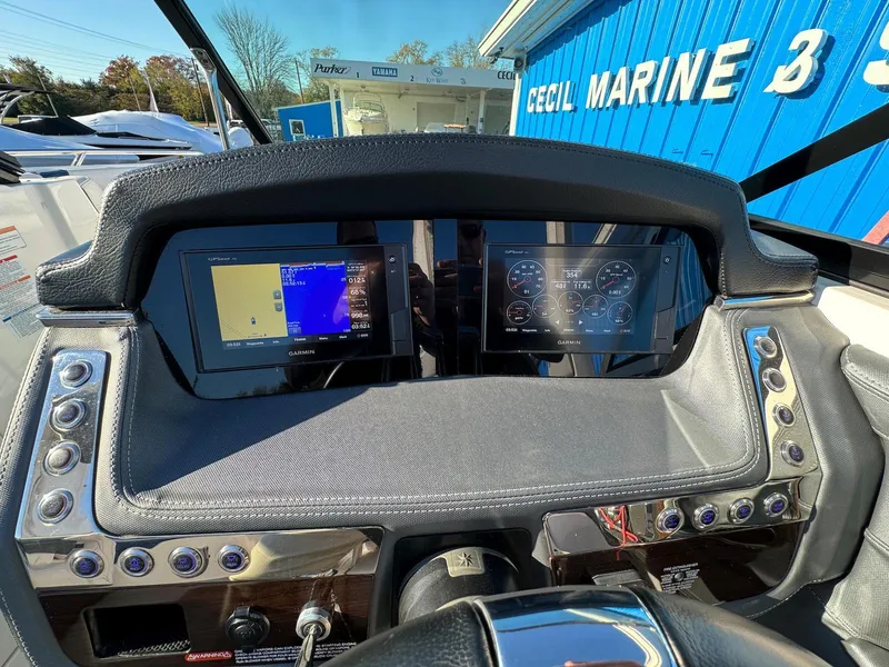 Slide: The Image of Dashboard of a 2020 Chaparral 257 SSX boat with dual digital displays. - 6