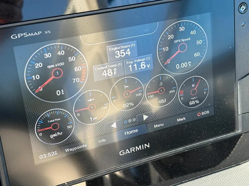 Slide: The Image of Garmin GPSMAP X5 display on 2020 Chaparral 257 SSX boat showing engine metrics. - 7