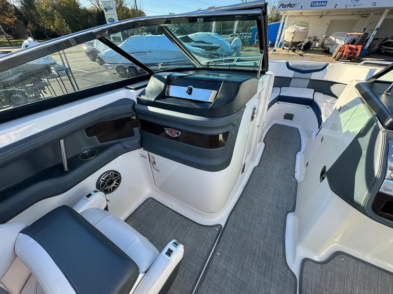 Slide: The Image of 2020 Chaparral 257 SSX boat interior with seating and dashboard. - 8