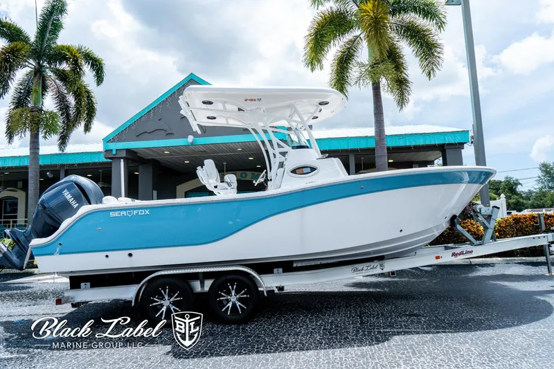 Slide: The Image of 2024 Sea Fox 248 Side Console boat on trailer, displayed outdoors. - 1