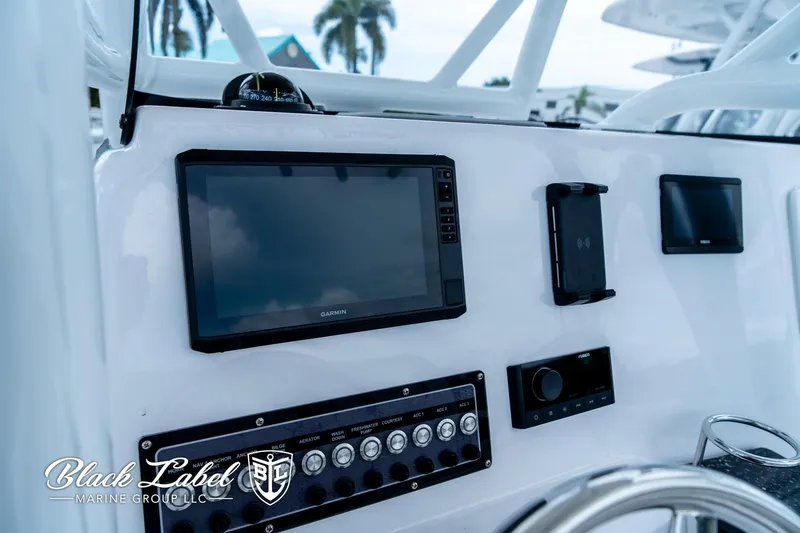 Slide: The Image of 2024 Sea Fox 248 Side Console dashboard with navigation and control panel. - 17