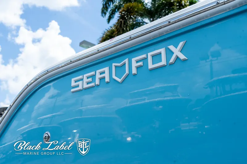 Slide: The Image of 2024 Sea Fox 248 Side Console boat with logo, blue exterior, and Black Label Marine Group branding. - 4