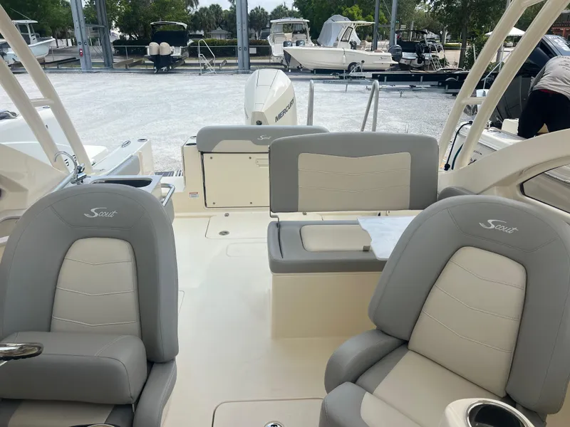 Slide: The Image of 2024 Scout 240 Dorado boat interior with gray and white seating. - 13