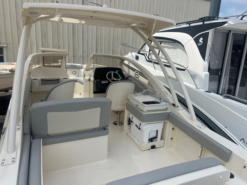 Slide: The Image of 2024 Scout 240 Dorado boat interior with seating and helm station. - 3