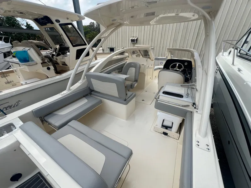 Slide: The Image of 2024 Scout 240 Dorado boat interior with seating and helm station. - 5