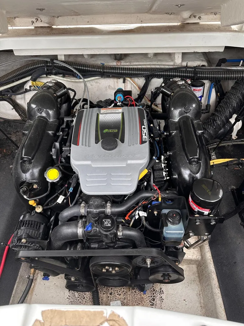 Slide: The Image of 2014 Crownline 255 SS boat engine compartment with MerCruiser 350 engine. - 11