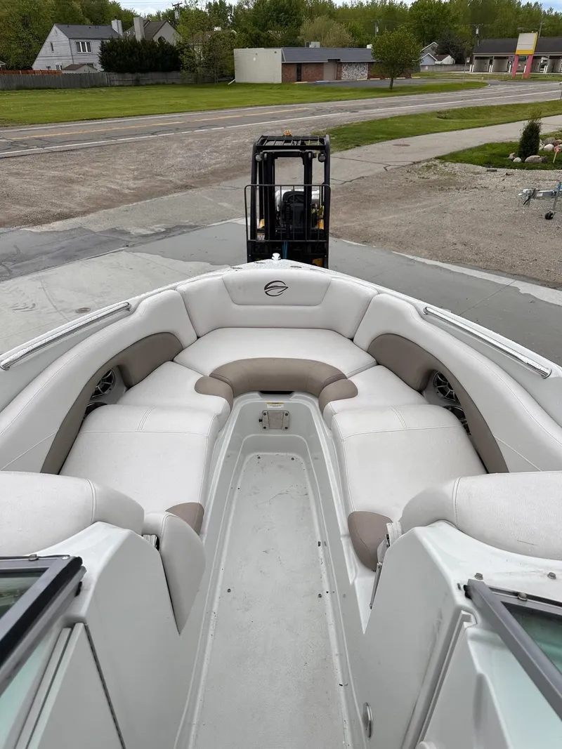 Slide: The Image of 2014 Crownline 255 SS boat with spacious seating and modern design. - 4