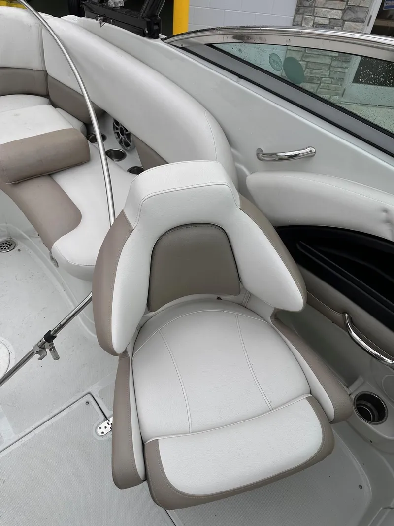 Slide: The Image of 2014 Crownline 255 SS boat interior with white and beige seating. - 5