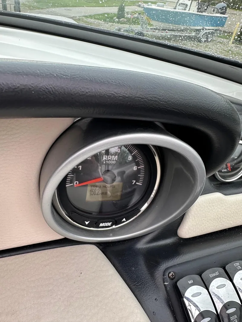Slide: The Image of Close-up of the dashboard and RPM gauge of a 2014 Crownline 255 SS boat. - 7