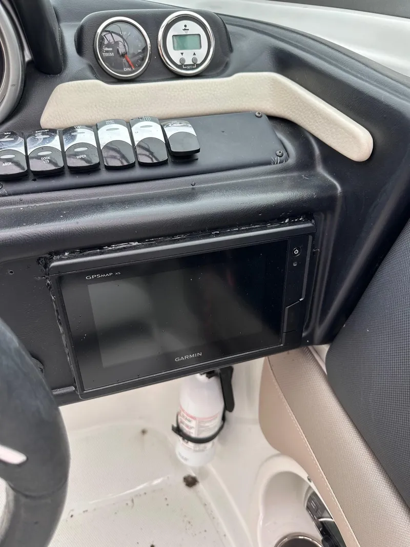 Slide: The Image of Dashboard of a 2014 Crownline 255 SS boat with Garmin navigation system. - 9