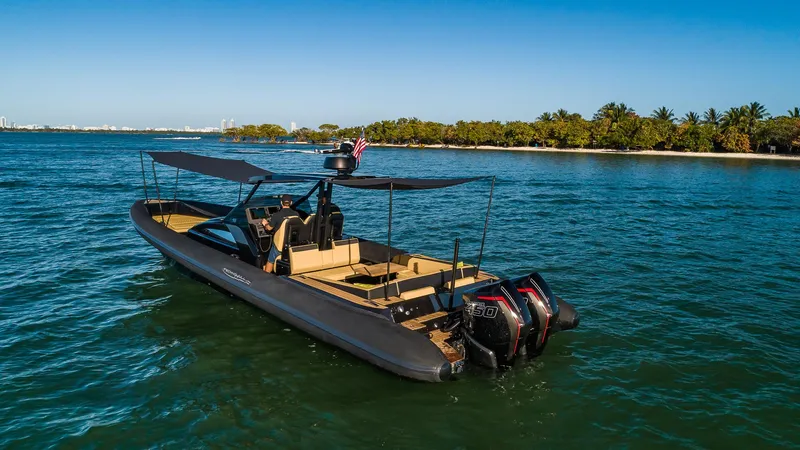 Slide: The Image of 2024 Technohull Explorer 40 boat on water near tropical shoreline. - 13