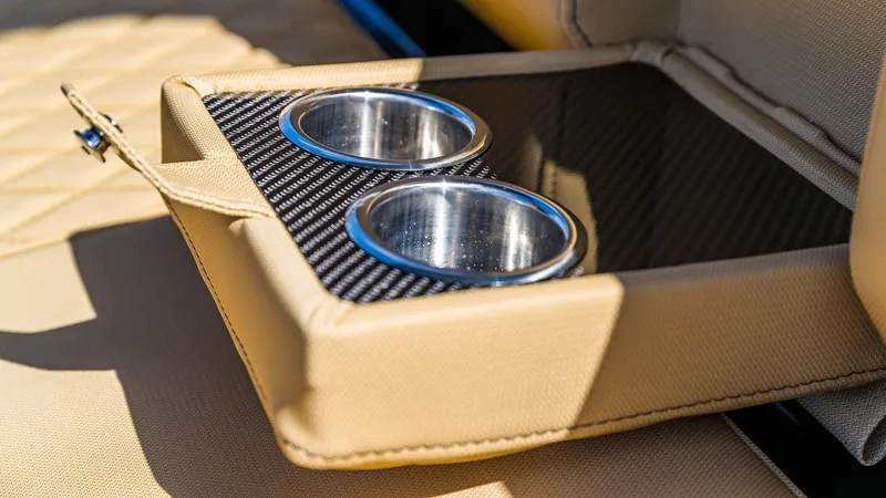 Slide: The Image of Cup holders on the 2024 Technohull Explorer 40's luxurious beige seating. - 22