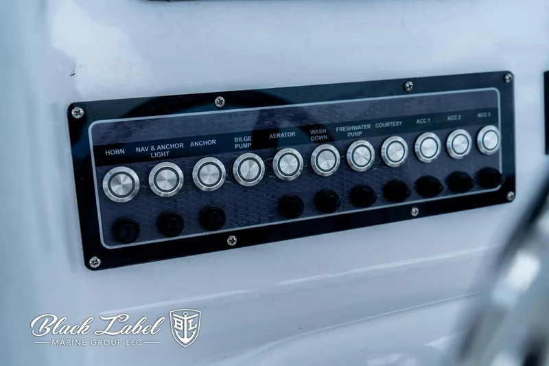 Slide: The Image of Control panel of 2024 Sea Fox 248 Side Console boat with labeled switches. - 18