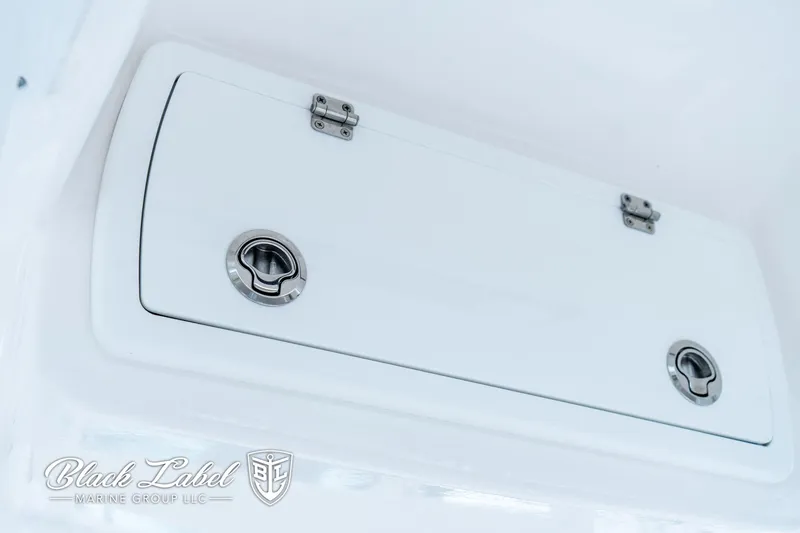 Slide: The Image of 2024 Sea Fox 248 Side Console storage compartment with secure latches, by Black Label Marine Group. - 21