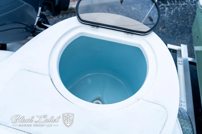 Slide: The Image of Livewell on 2024 Sea Fox 248 Side Console boat, open lid view. - 26