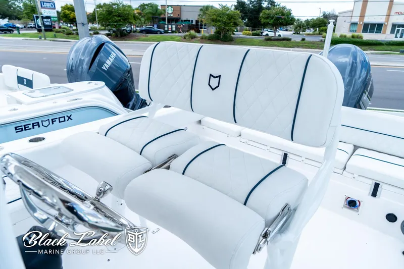 Slide: The Image of 2024 Sea Fox 248 Side Console boat with luxurious seating and dual Yamaha engines. - 14