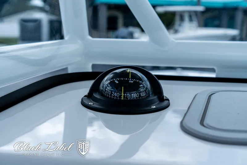 Slide: The Image of Compass on 2024 Sea Fox 248 Side Console boat dashboard, Black Label Marine Group. - 16